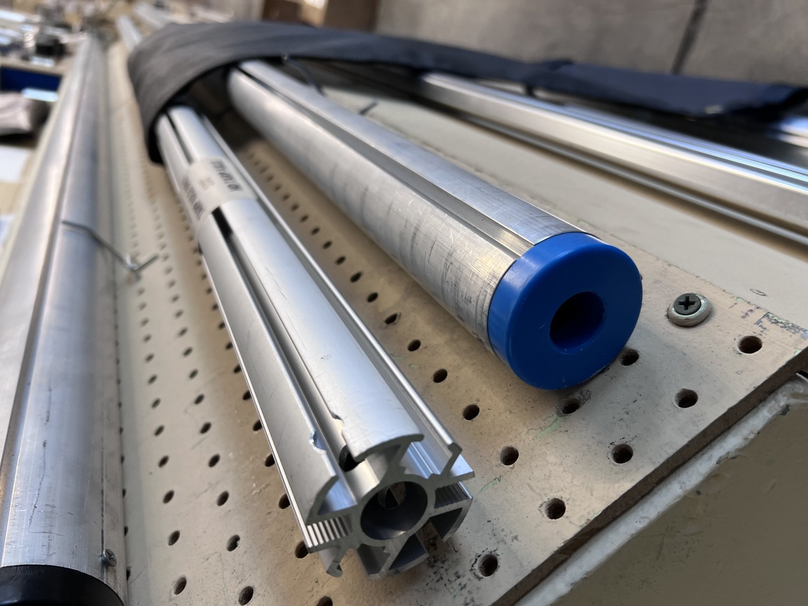 Roller bars! 2 options: one is Heavy Duty extruded aluminum and the other is adjustable, no cutting needed and can ship UPS